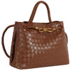 Stylish brown woven satchel with a braided handle and gold accents, perfect for adding elegance to any look in Long Island boutique fashion.