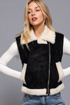 Stylish black faux suede vest featuring a cozy cream fur collar and hem, perfect for layering in Long Island boutique fashion.