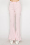 Light pink elastic wide leg pants with a ribbed texture and adjustable drawstring waistband, perfect for relaxed Long Island boutique fashion.