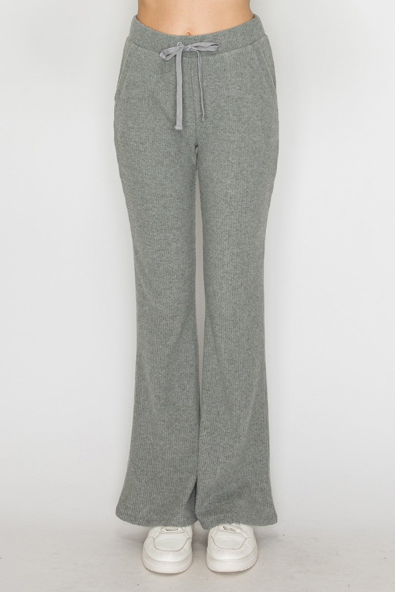 Soft gray elastic wide-leg pants with a comfortable drawstring waistband, perfect for relaxed outfits in Long Island boutique fashion.