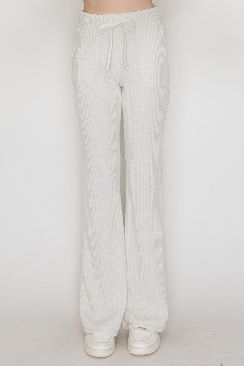 Soft, ribbed elastic wide-leg pants in a light gray hue, perfect for a relaxed yet stylish look in Long Island boutique fashion.
