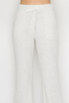 Light grey elastic wide leg pants featuring a soft ribbed texture and adjustable drawstring waistband, perfect for Long Island boutique fashion.