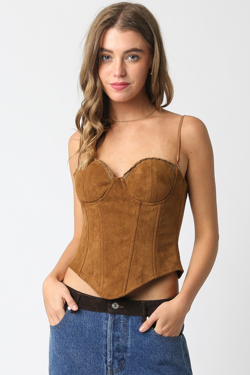 Model wearing Reese Suede Corset Top in camel — structured faux suede bustier with adjustable straps and tie-back detail, available at TandyWear Boutique in Commack, NY. front view 