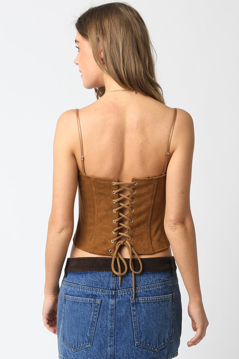 Model wearing Reese Suede Corset Top in camel — structured faux suede bustier with adjustable straps and tie-back corset detail, available at TandyWear Boutique in Commack, NY. back view 