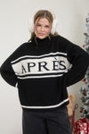 Cozy black turtleneck pullover with bold white "APRES" lettering and striped detailing, perfect for Long Island boutique fashion enthusiasts.
