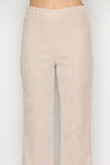 Light beige fit and flare pants featuring a smooth texture and tailored fit, perfect for Long Island boutique fashion.