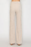 Light beige fit and flare pants with a soft texture and a flattering silhouette, perfect for Long Island boutique fashion.