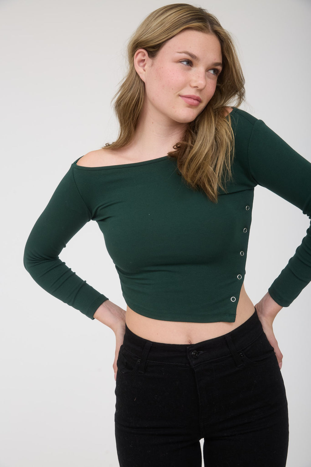Brown asymmetrical long sleeve crop top with snap button detailing, perfect for stylish layering in Long Island boutique fashion.
