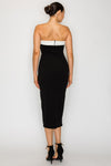 Strapless black capri dress with a contrasting white bodice, tailored fit, and sleek mid-length design, perfect for Long Island boutique fashion.