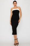 Strapless black tube dress featuring a white bow detail at the neckline, perfect for Long Island boutique fashion styling.