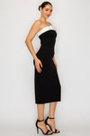 Strapless black capri dress featuring a white bow detail at the neckline, perfect for chic Long Island boutique fashion.