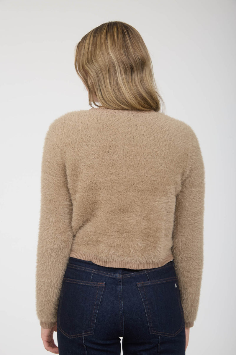 Soft, beige fuzzy knit cardigan featuring gold buttons and a cropped fit, perfect for layering in Long Island boutique fashion.