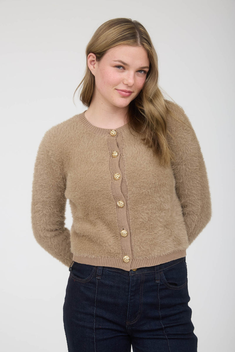 Soft tan fuzzy knit cardigan featuring stylish gold buttons, perfect for adding warmth to any outfit from this Long Island fashion boutique.