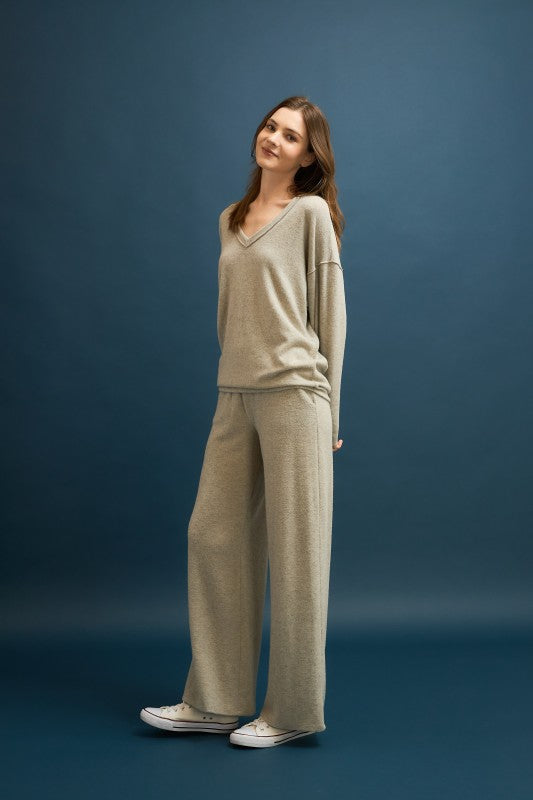 Soft cashmere brushed wide-leg pants in a light gray tone, offering effortless elegance for Long Island boutique fashion.