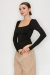Women’s black square neck long sleeve bodysuit — fitted stretch knit with snap closure, sleek minimalist top available at TandyWear Off Price, Commack NY.