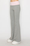 Heathered gray fit and flare pants feature a soft pink waistband, perfect for casual and comfortable Long Island boutique fashion.