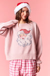 Model wearing pink Santa knited Sweater featuring vintage Santa design — cozy knit pullover available at TandyWear Boutique in Commack, NY. front view