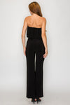 Sleek black balloon bandeau jumpsuit with wide legs, ideal for elegant outings, reflecting the essence of Long Island boutique fashion.