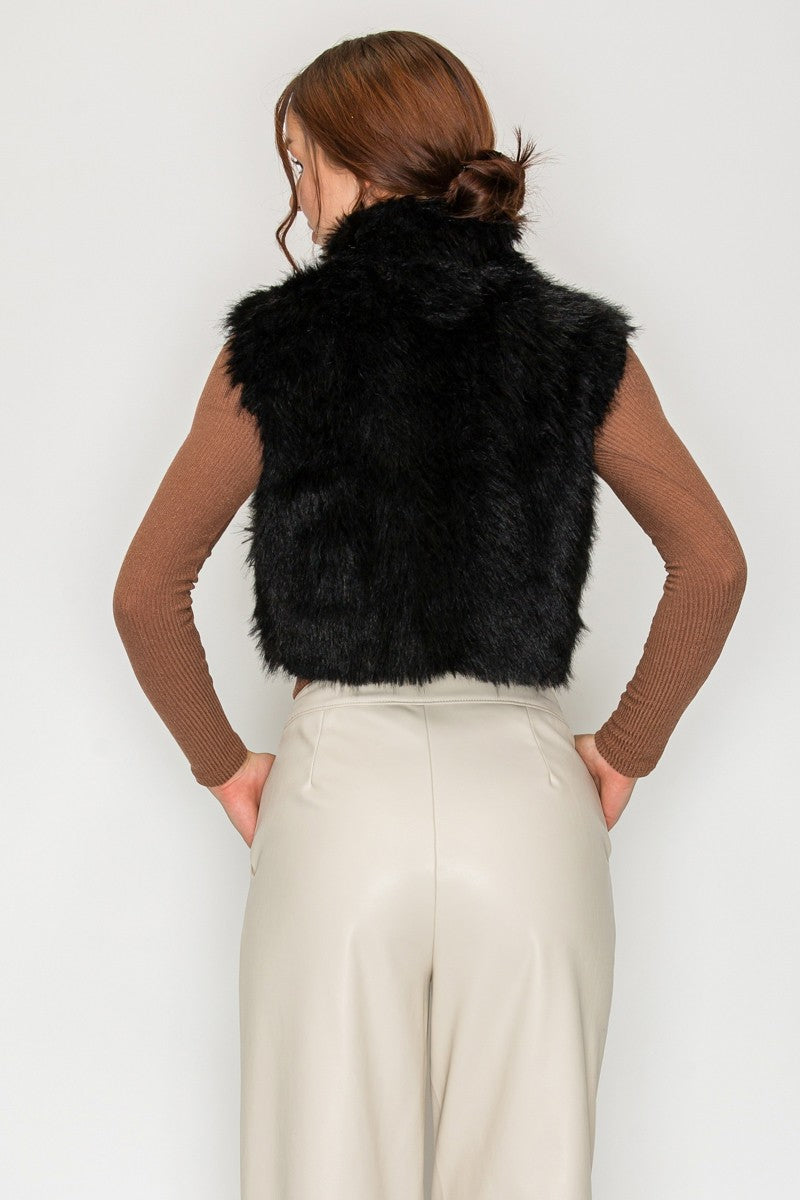 Back view of soft faux fur cropped vest in black