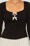 Black rhinestone bow knit top with square neckline and long sleeves – available at TandyWear Off Price 