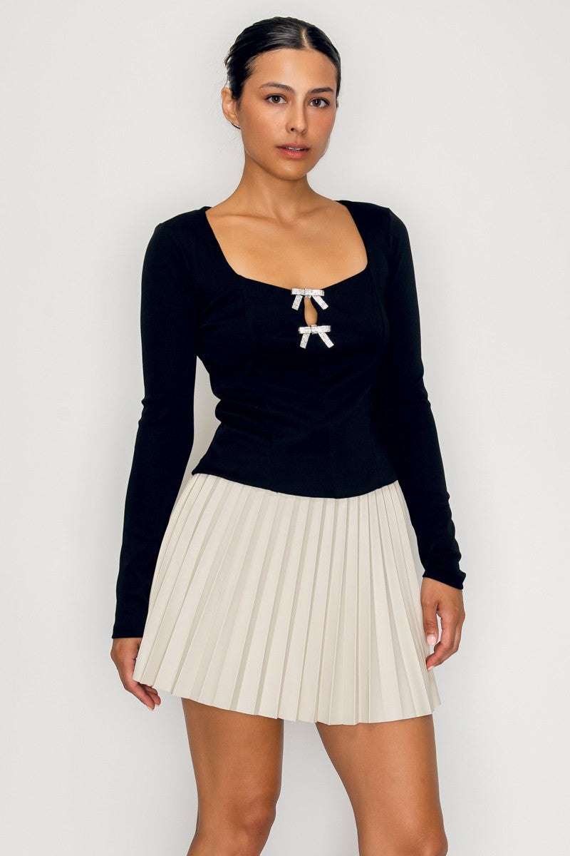 Black rhinestone bow knit top with square neckline and long sleeves – available at Off Price TandyWear