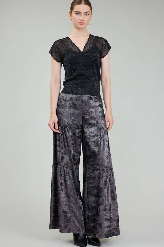 Glitter Woven Combo Sweater features a shimmering black bodice with lace sleeves, paired with elegant gray wide-leg pants, perfect for Long Island boutique fashion.