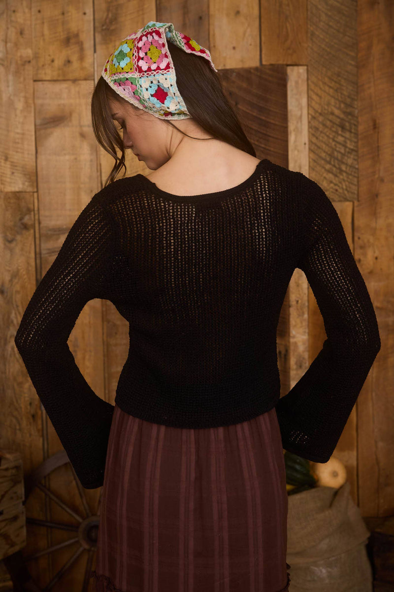 Black crochet knit cardigan with bell sleeves and front buttons, perfect for layering in Long Island boutique fashion.