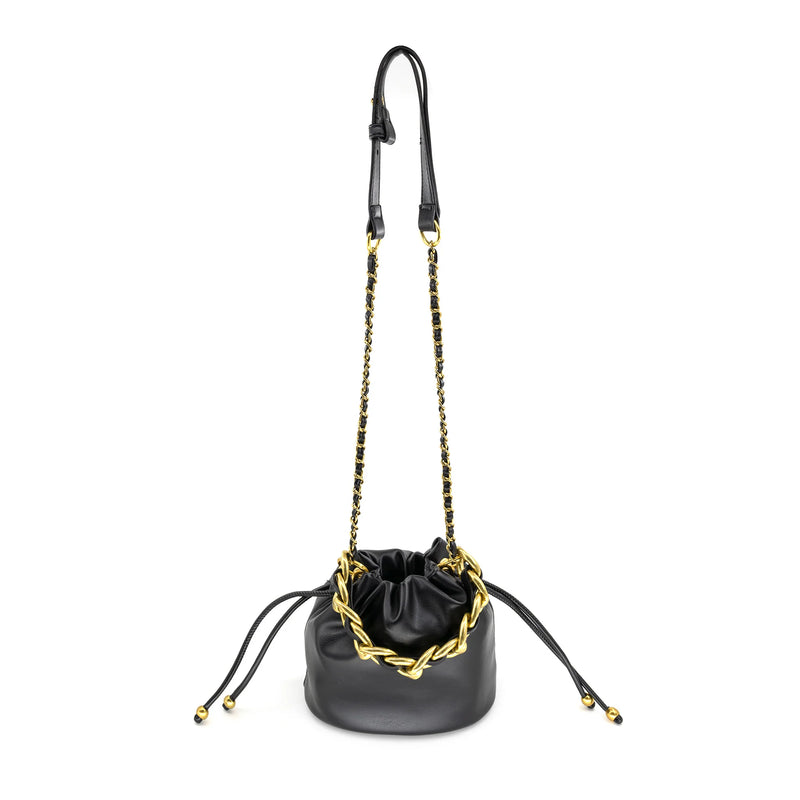 Small black leather bag with a gold detailed chain and drawstring closure, perfect for Long Island boutique fashion.
