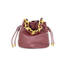 Soft burgundy bucket bag featuring a stylish gold chain detail and drawstring closure, perfect for Long Island boutique fashion.