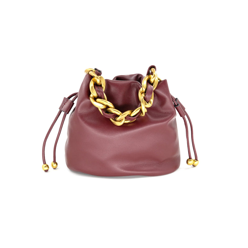 Soft burgundy bucket bag featuring a stylish gold chain detail and drawstring closure, perfect for Long Island boutique fashion.