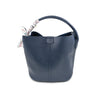 Textured navy bucket bag featuring a stylish scarf tied to the handle, perfect for chic Long Island boutique fashion.
