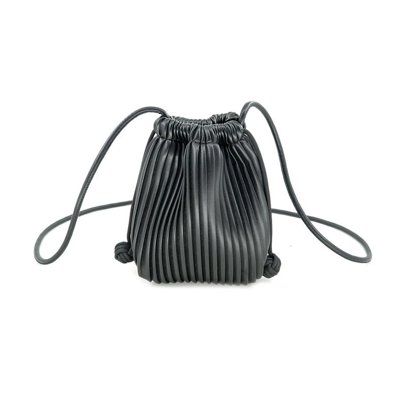 Small black crossbody bag with a pleated design, adjustable straps, and a drawstring closure, perfect for Long Island boutique fashion.