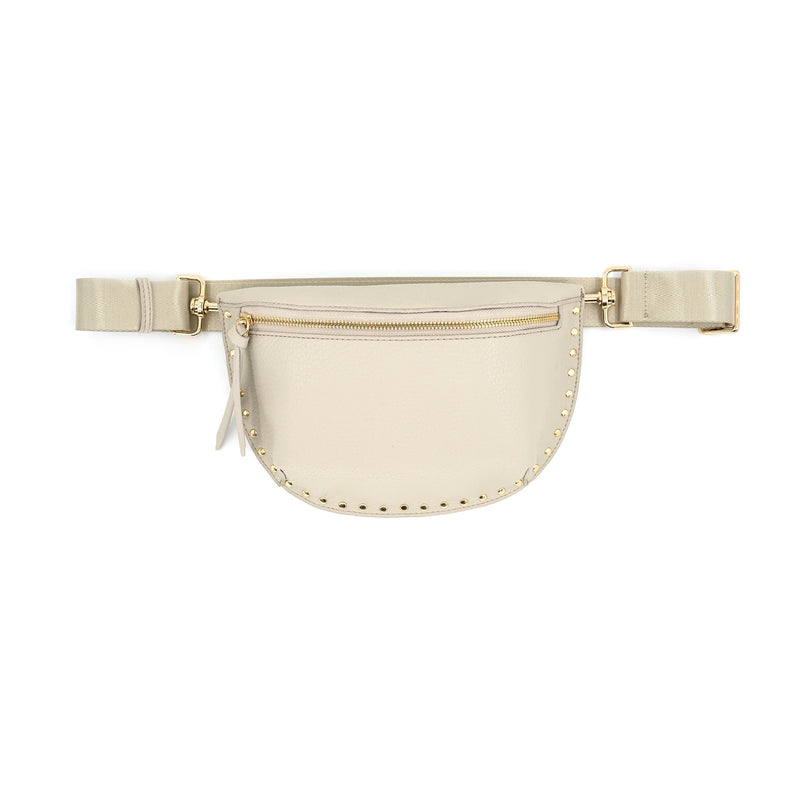 Stylish cream fanny pack adorned with metallic studs, featuring a zippered front pocket and adjustable strap, perfect for Long Island boutique fashion.