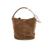 Soft brown suede bucket bag with a smooth finish and a patterned strap, perfect for a chic look at a Long Island fashion boutique.