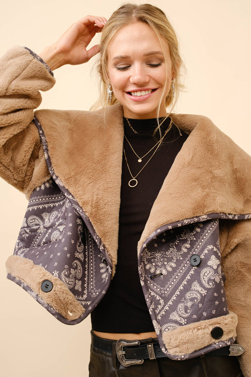Double-breasted crop jacket in tan faux fur with contrasting paisley bandanna lining, perfect for chic Long Island boutique fashion.