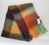 Plaid scarf with fringes and a tag on a white background