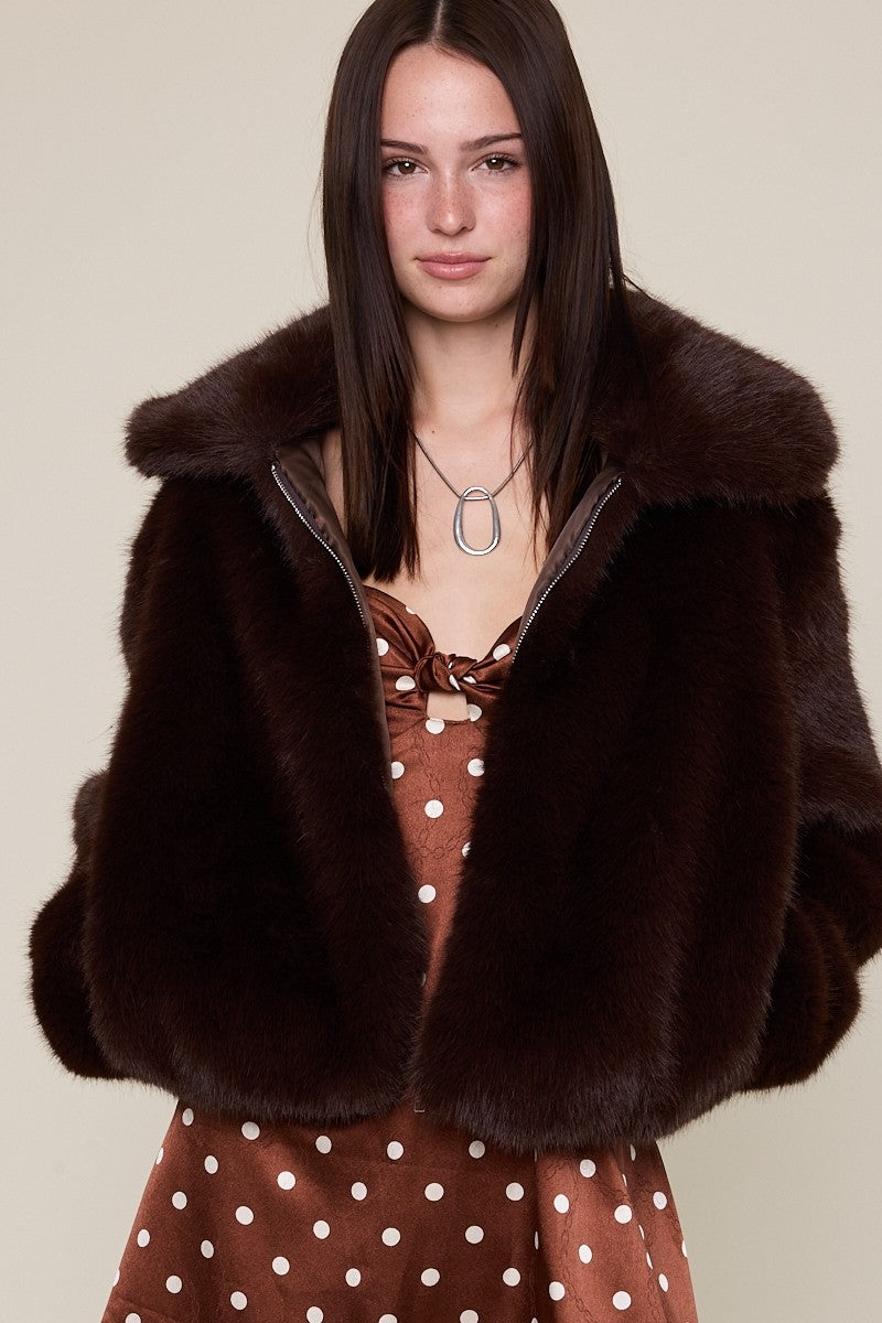 Luxurious brown faux fur jacket with a soft collar and a cozy fit, perfect for stylish layers in Long Island boutique fashion.