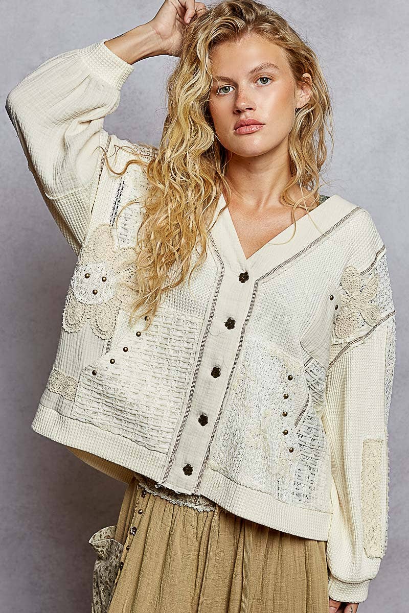 Model wearing V-Neck Patch Detail Stud Hoodie in Powder Cream with lace and stud accents — boho thermal top available at TandyWear Boutique in Commack, NY.