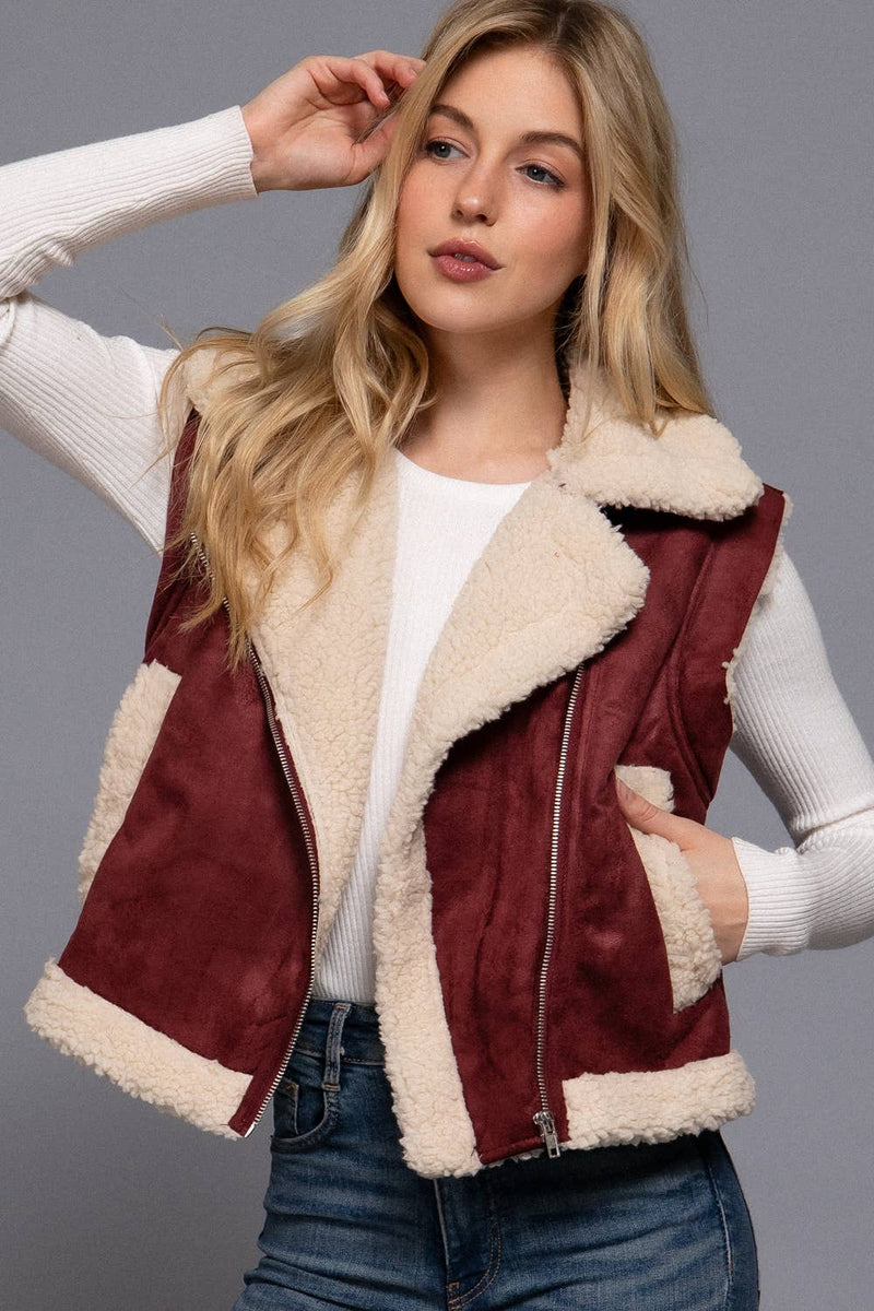 Warm faux suede zip-up vest in rich burgundy with cozy inner fur lining, perfect for layering in Long Island boutique fashion.