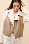 Faux leather moto vest with shearling trim in a soft taupe tone, perfect for layering in Long Island boutique fashion.