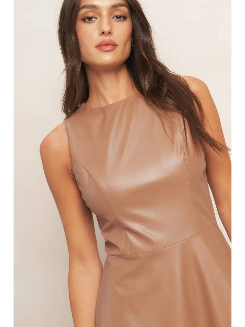 Sleek faux leather midi dress in a flattering tan shade, featuring a sleeveless design and a clean, structured silhouette for Long Island boutique fashion.