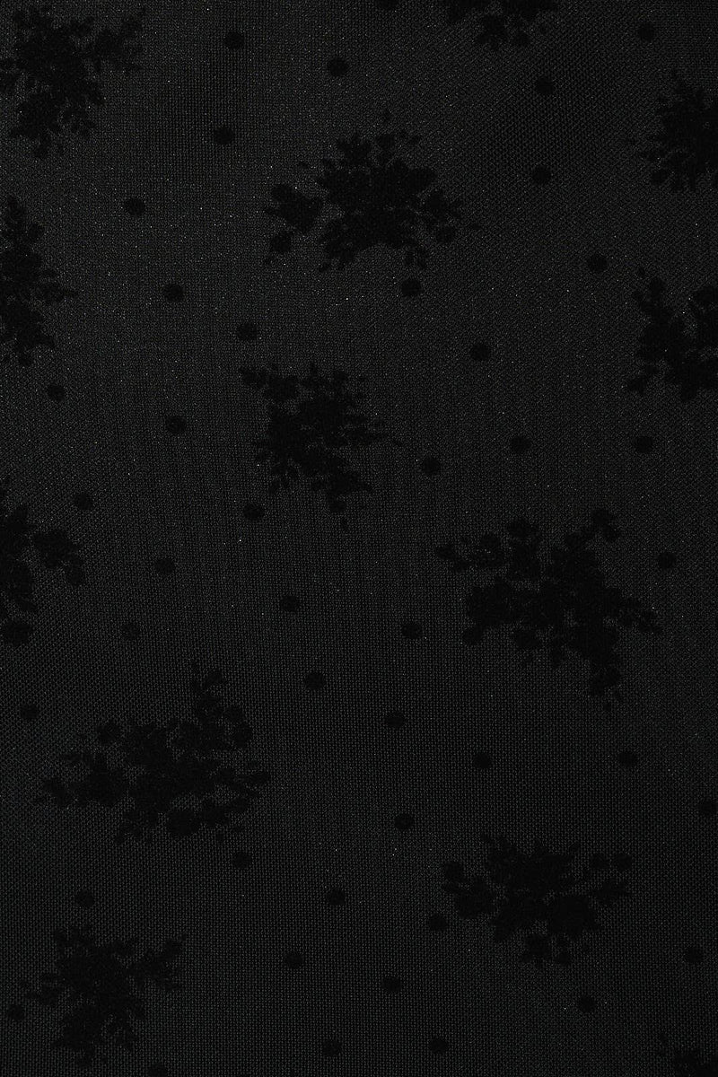 Black halter neck mini dress featuring a subtle floral pattern and textured polka dots, embodying chic Long Island boutique fashion.