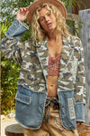 Relaxed-fit denim woven jacket blending a camo pattern with frayed edges, ideal for casual Long Island boutique fashion.