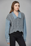 Crochet-style, light gray knit sweater combined with denim sleeves and collar, perfect for Long Island boutique fashion.
