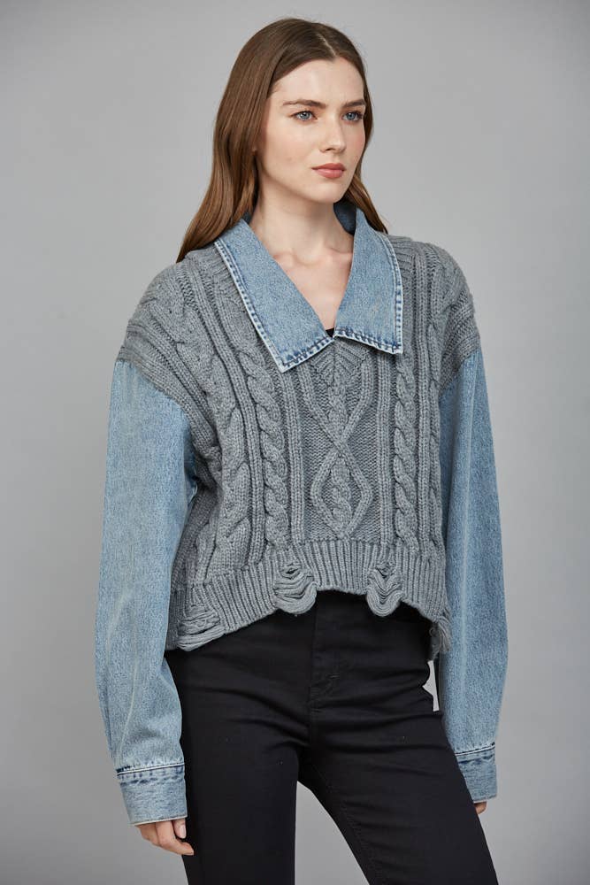 Crochet-style, light gray knit sweater combined with denim sleeves and collar, perfect for Long Island boutique fashion.