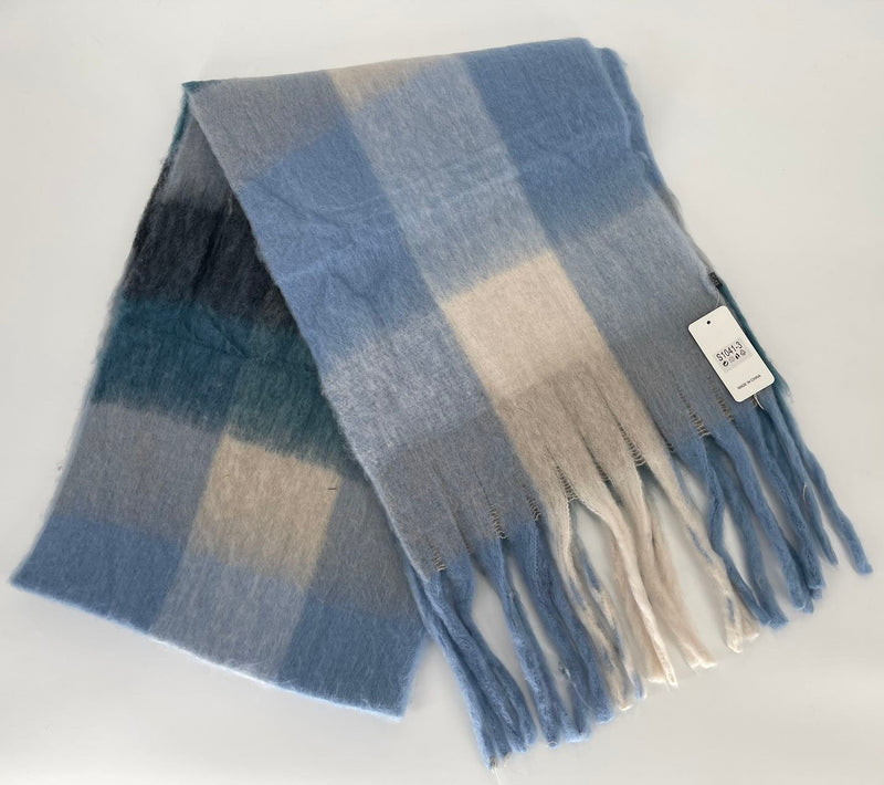 Plaid scarf with fringes and a tag on a white background