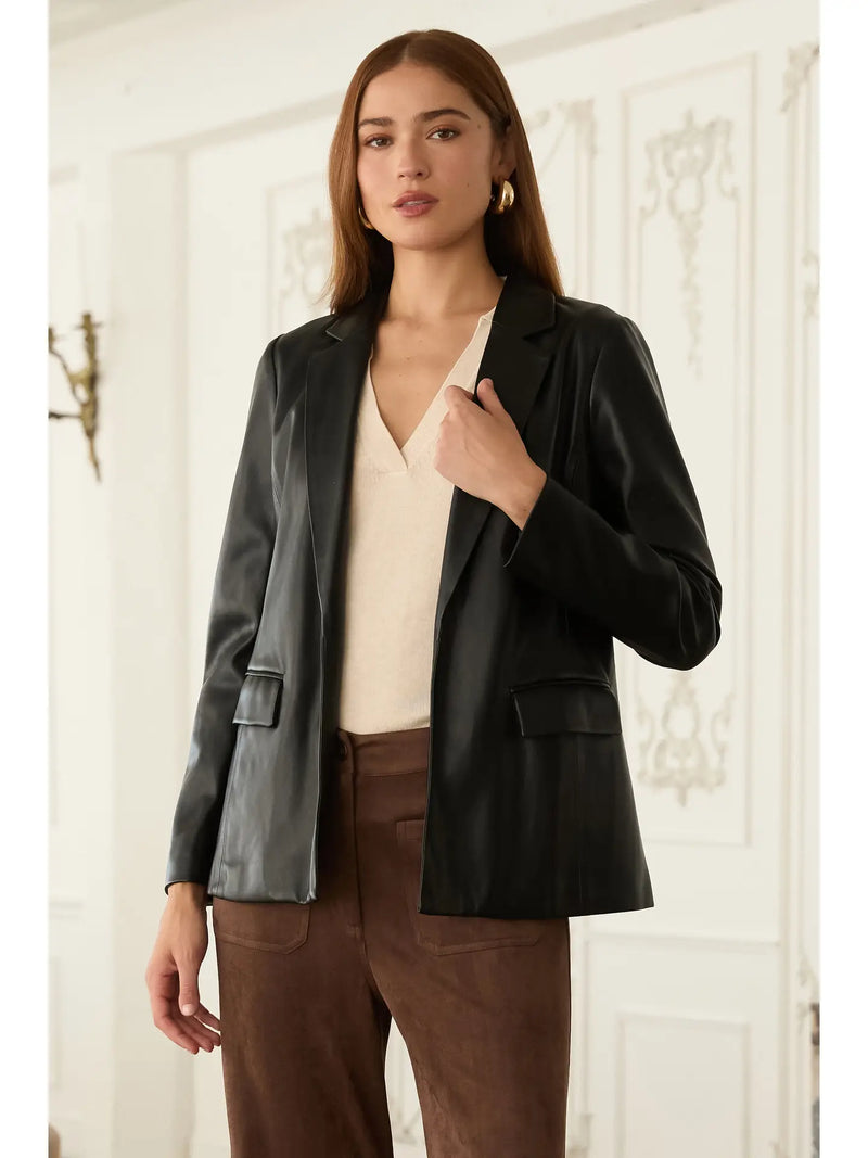 Sleek black faux leather open blazer with a tailored fit and subtle pocket details, perfect for Long Island boutique fashion.