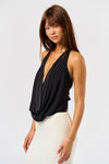Sleek black cowl bodysuit with a deep neckline, perfect for layering in chic Long Island boutique fashion.