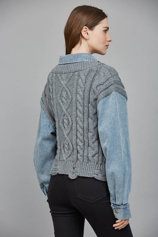 Cozy gray cable-knit sweater combined with a denim shirt, featuring a cropped fit and stylishly textured sleeves, ideal for Long Island boutique fashion.