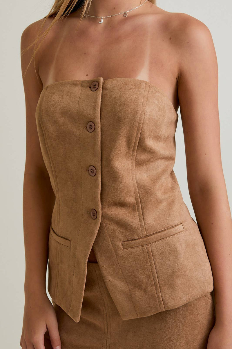 Tan button-front suede tube blazer top with a fitted silhouette and subtle flap pockets, perfect for Long Island boutique fashion.